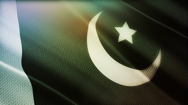 Close up view of the Pakistan national flag with a white crescent moon. Pakistan flag for independence day.