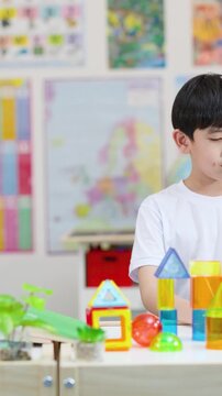 Children Learning With Colorful Blocks and Classroom Activity Table