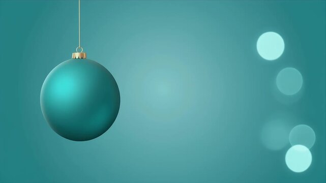 Hanging Teal Christmas Ornament with Soft Bokeh Lights in Minimalist Studio Setting