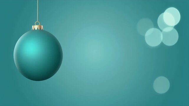 Hanging Teal Christmas Ornament with Soft Bokeh Lights in Minimalist Background