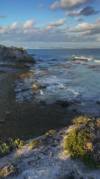 4k 60p vertical footage of stunning turquoise waters on Arniston&rsquo;s beautiful Overberg coastline with sand dunes visible in the background. Western Cape, South Africa. Iconic, remote coastal serenity.