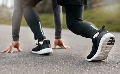Fototapeta premium Fitness, starting position or sprinter on road with exercise, athletics or ready in performance routine. Begin, person or runner with go preparation, crouch or cardio activity in outdoor training.