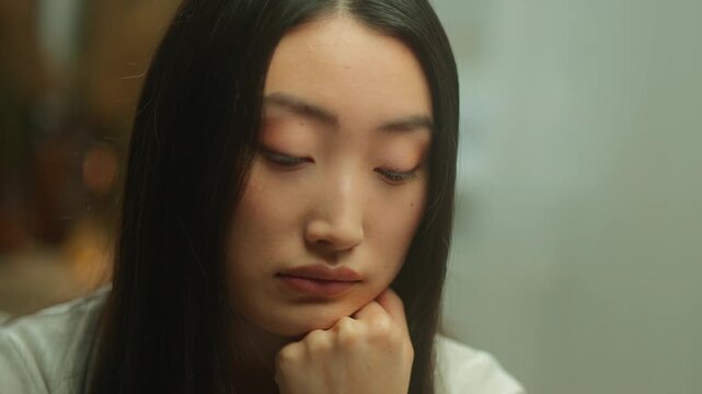 Pensive thinking Asian Chinese Korean woman thoughtful think problem dreamy worried anxiety disappointed sad Japanese girl female hesitate pondering solution decision consider problem trouble decide