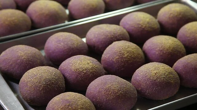 Freshly baked Filipino bread called Ube cheese pandesal