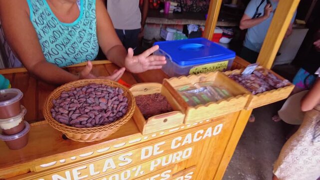 POV of cocoa beans in a basket at an artisanal chocolate showroom in Chuao, Aragua, Venezuela