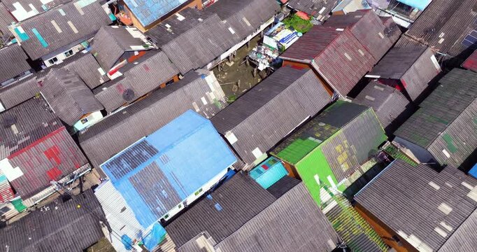 Flying Above Rooftops In Floating Village Of Koh Panyee In Phang Nga Bay, Thailand. aerial topdown shot