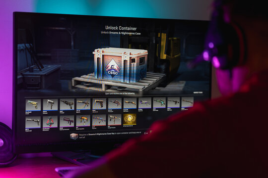 Gamer about to open a virtual loot box in a Counter Strike 2 video game, illustrating the connection between gaming mechanics, microtransactions, and potential gambling addiction.