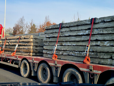 heavy-duty transport of precast concrete slabs. classic example of logistical engineering, highlights some serious safety requirements for road.Tension: These straps use friction to keep slabs from 