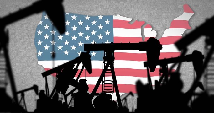 Showing oil pumpjack cluster with vertical ladder casting silhouettes against U