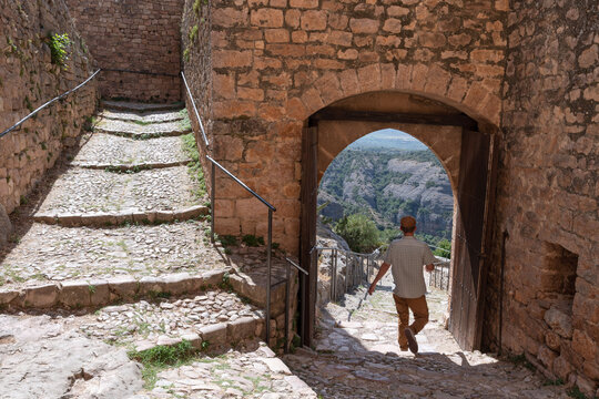 Tourist strolling through the Medieval Village of Alquezar. Huesca, Arag&oacute;n