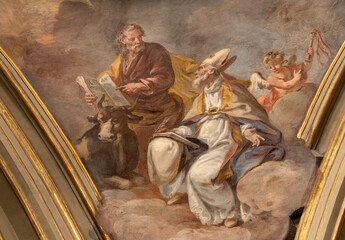 Obraz premium BERGAMO, ITALY - MARCH 21, 2026: The fresco of St. Luke the Evangelist and St. Ambrose by in the church Chiesa di San Alessandro in Colonna by Vincenzo Angelo Orelli (1751 – 1813).