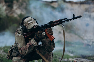 Fototapeta premium Portrait of Ukrainian soldier shooting at the range