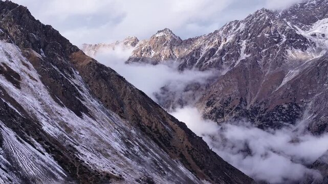 Rocky Snowy Mountains Above Clouds Kyrgyzstan Tien Shan Drone View