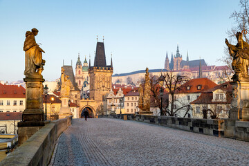 Fototapeta premium charles Bridge in Prague Czech Republic at sunrise with historic statues