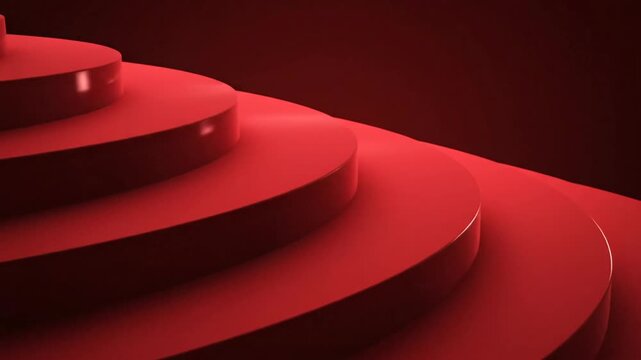 Red stairs spiral to darkness.