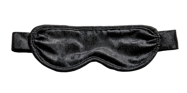 A close-up view of a black sleep mask, featuring a soft fabric texture