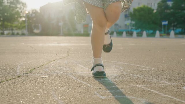 Kid child baby boy girl happy family, child dream, Retro playground vibes, feet hopping on pavement, chalk-drawn hopscotch grid, sunshine shadows, quiet school yard, family-friendly moment, kids