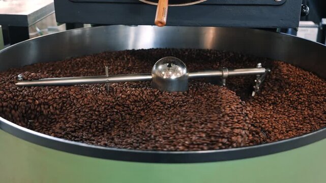 Coffee Beans Roasting in Industrial Drum Roaster