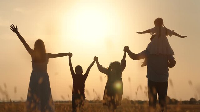 boy girl mother father son daughter dream teamwork hands up sun silhouette religion faith together vacation travel Christianity, family bonding activities, parenting advice tips, child education
