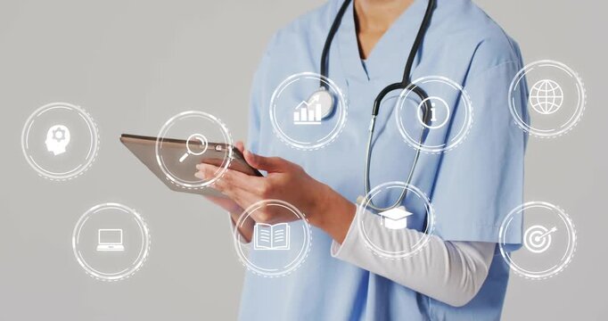Clinician tapping tablet on gray backdrop initiating search and chart icons swiping and using info