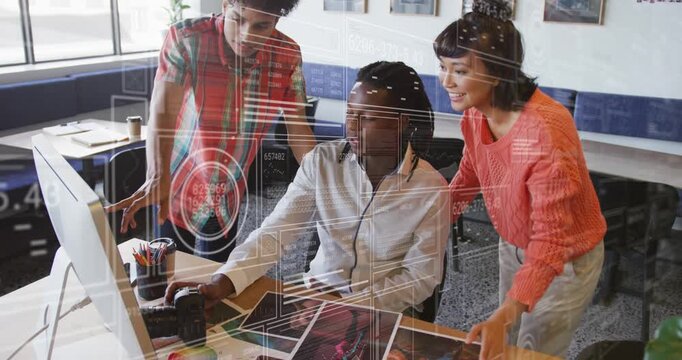 Seated man clicking mouse, initiating HUD overlay, team pointing to monitor editing design proofs