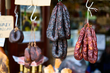 Sausage stall. Ponte de Lima (Portugal), March 30, 2026. Shop selling typical sausages from northern Portugal, hams, and chorizos, generally sold smoked. 