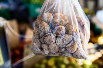 Bag of figs. Ponte de Lima (Portugal), March 30, 2026. Display of figs outside a food shop selling traditional products from the Minho region.