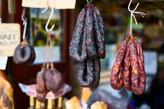 Sausage stall. Ponte de Lima (Portugal), March 30, 2026. Shop selling typical sausages from northern Portugal, hams, and chorizos, generally sold smoked.
