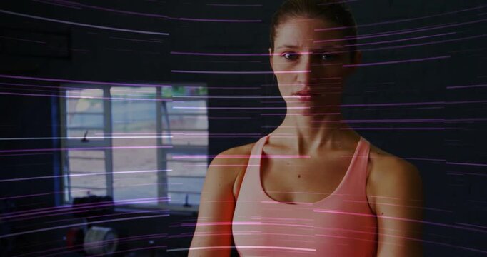 Fitness athlete fixing waist, crossing arms, pulling back showing face light streak sweeping window