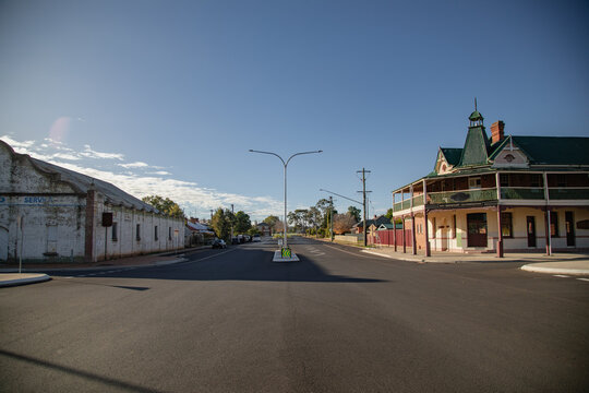 Quiet Australian country town street scene with historic buildings and clear blue sky