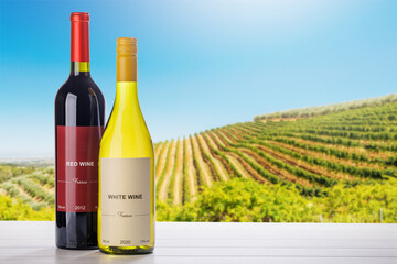 Fototapeta premium Wine bottles mockup in sunlit vineyard