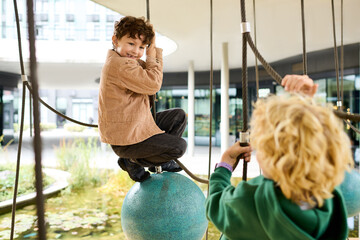 Obraz premium Joyful autumn playtime in the park captures the essence of childhood bliss