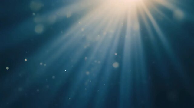 Ethereal sun rays through deep blue water with floating particles