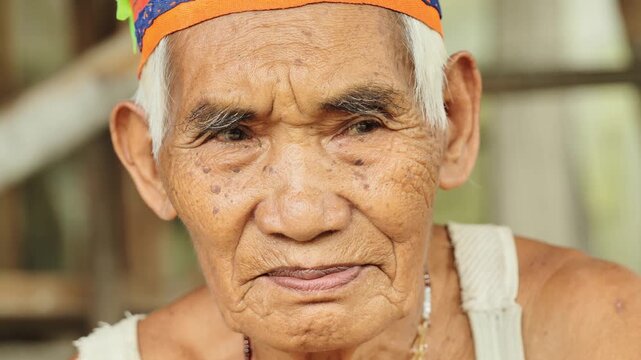 Close up portrait showing aged skin texture and quiet strength Batad Philippines