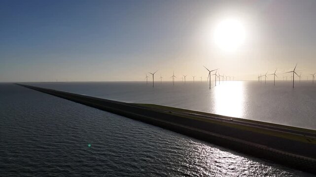 Backlit dam silhouette from the North Sea side