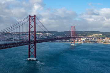 Fototapeta premium Travel photo of Lisbon, Portugal showing the bridge leading toward the Cristo Rei monument, captured during holiday exploration.