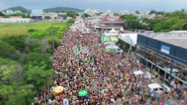 Aerial view of the street block carnival named Samambloco on the street of the town of Campeche, Florianopolis, Brazil
