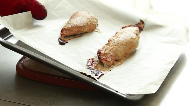 Roasted pork bon file with Dijon mustard crust fresh from the oven, close up of succulent meat