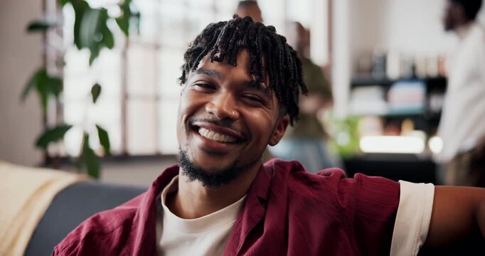 Confidence, relax and face of man on sofa in home for weekend, holiday and afternoon break. Happy, smile and portrait of person on couch with vacation, positive attitude and laugh in living room