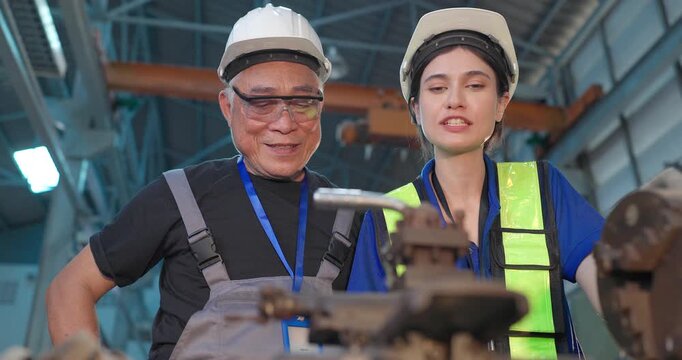 Father passes down machine know-how to his daughter in a family factory, guiding succession, workshop skills and leadership transition through hands-on manufacturing training.
