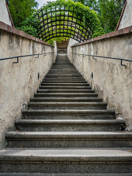 Long Stone Staircase Under Dark Wrought Iron Archway Tunnel To Top, Prague, Czech Republic