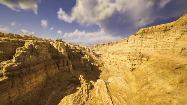 Golden hour canyon bathed in warmth, soft light accentuating ochre tones and rugged textures, peaceful valley mood perfect for wellness and landscape imagery.