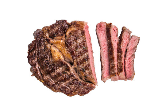 Grilled Rib eye steak with herbs, roast prime beef meat isolated on white background