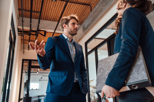 Team members communicating and cooperating in a modern office
