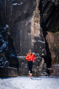 Runner training outdoors in winter rocky landscape at Baden-Wuerttemberg