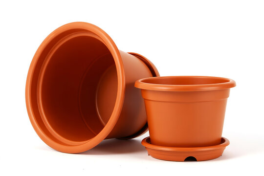 Two Brown Plastic Flower Pots with Saucers Isolated on White Background