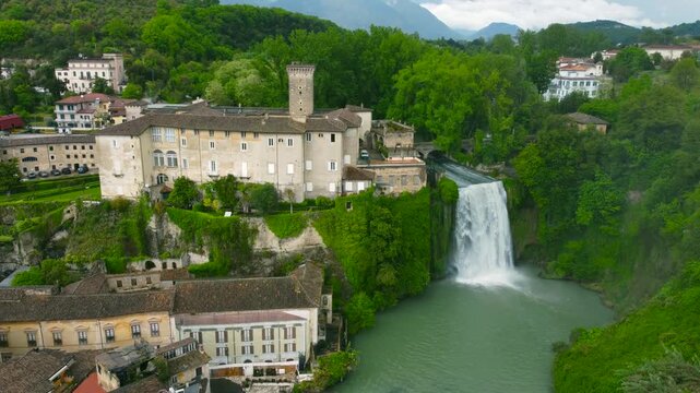Town of Liri Island - Waterfall and Boncompagni Viscogliosi Castle - Drone view, moving away from waterfall and castle