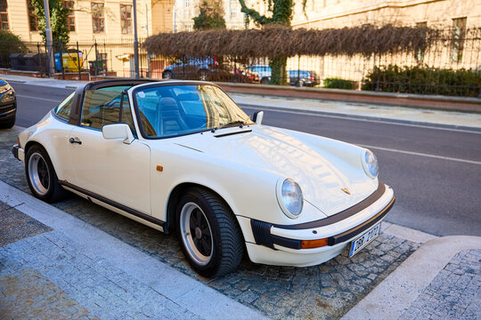 Classic white porsche 911 targa parked on urban street. March 18, 2026, Brno, Czech Republic