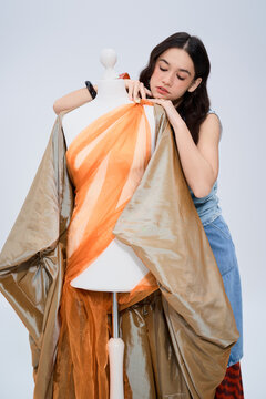 Creative young designer curates a trendy collection in her stylish studio