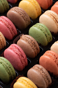 Colorful french macarons displaying sweet assorted pastries